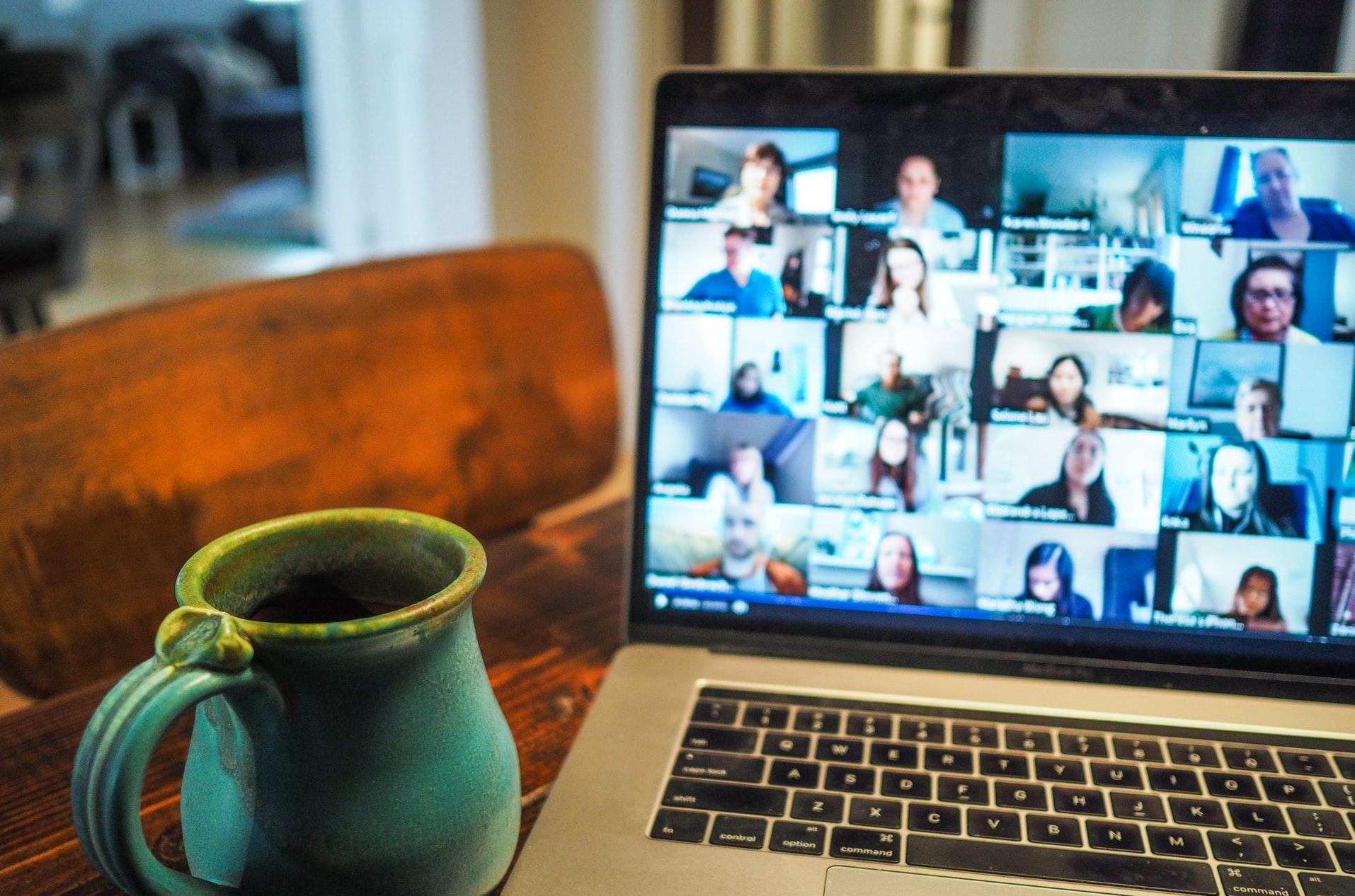 macbook pro displaying group of people